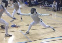 Woman fencing in a gym